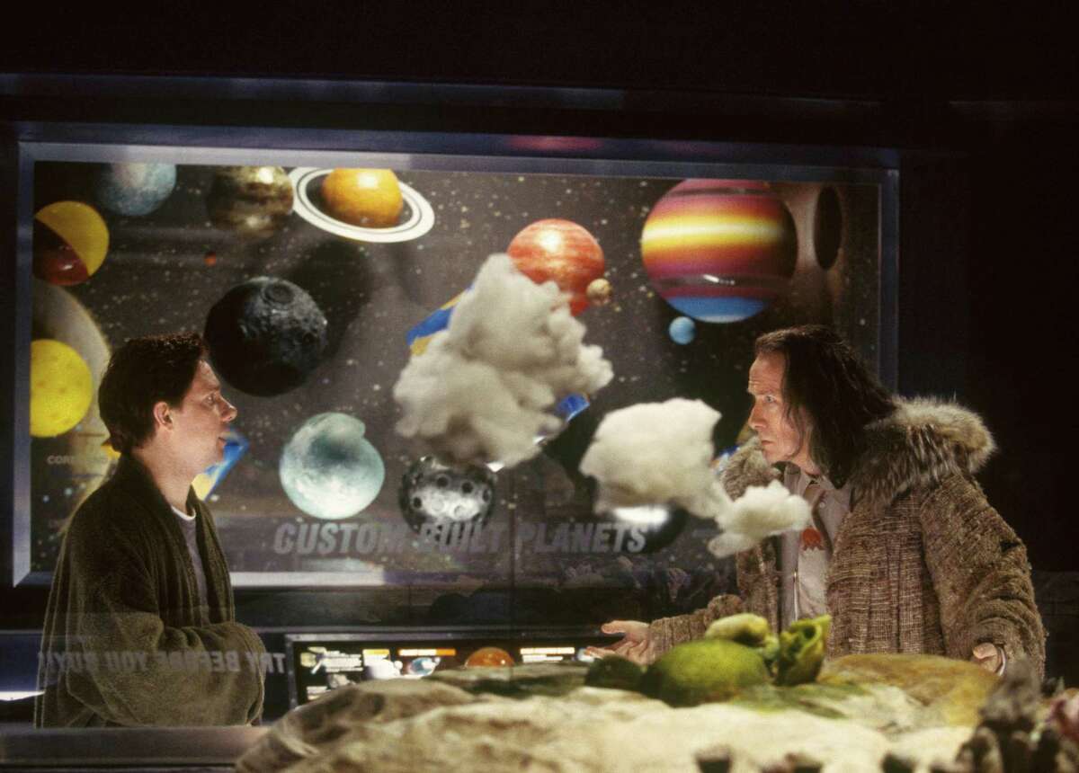 Martin Freeman (left) as Arthur Dent and Bill Nighy as Slartibartfast in a scene from the film adaptation of Douglas Adams' "The Hitchhiker's Guide to the Galaxy."