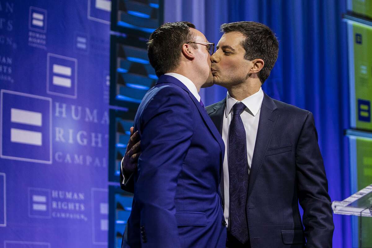 IMAGE DISTRIBUTED FOR HUMAN RIGHTS CAMPAIGN - Democratic presidential candidate Pete Buttigieg is joined on stage by husband Chasten Glezman Buttigieg after delivering a keynote address during the Human Rights Campaign's 14th annual Las Vegas Gala at Caesars Palace on Saturday, May 11, 2019. (Joe Buglewicz/AP Images for Human Rights Campaign)