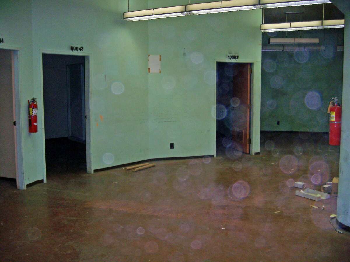 WSDOT's caption: At the doorway to the main room, looking to the left. Those three doorways lead to individual rooms that would have been used for food storage, medical assistance and day-to-day operations had there been a nuclear attack.