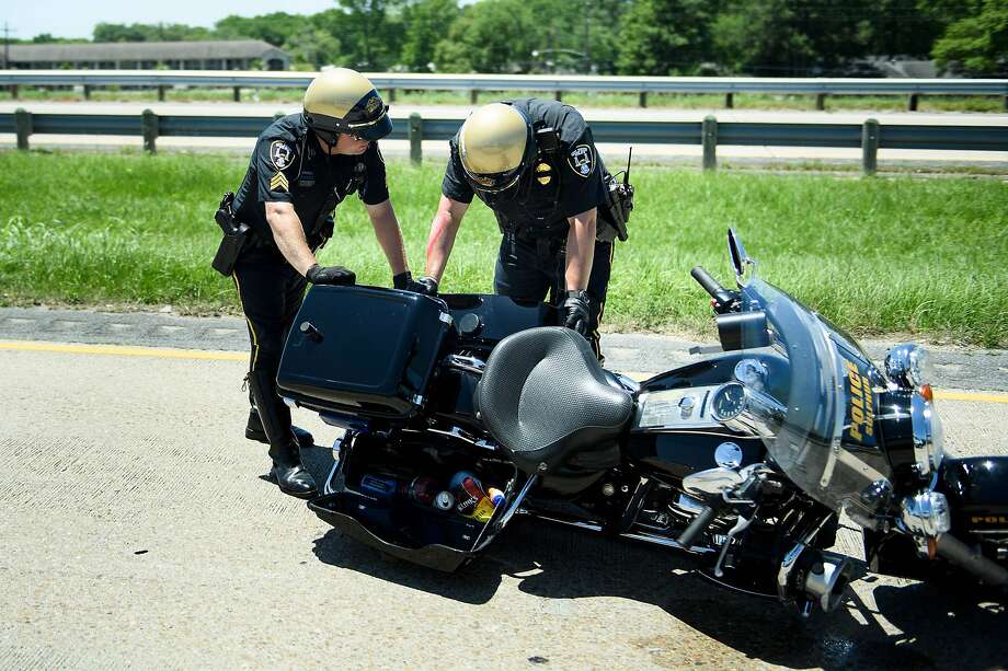 Local Motorcycle Tyre Fitters, Police Officers Move A Police Motorcycle Involved In An Accident While Escorting A Motorcade With Us, Local Motorcycle Tyre Fitters