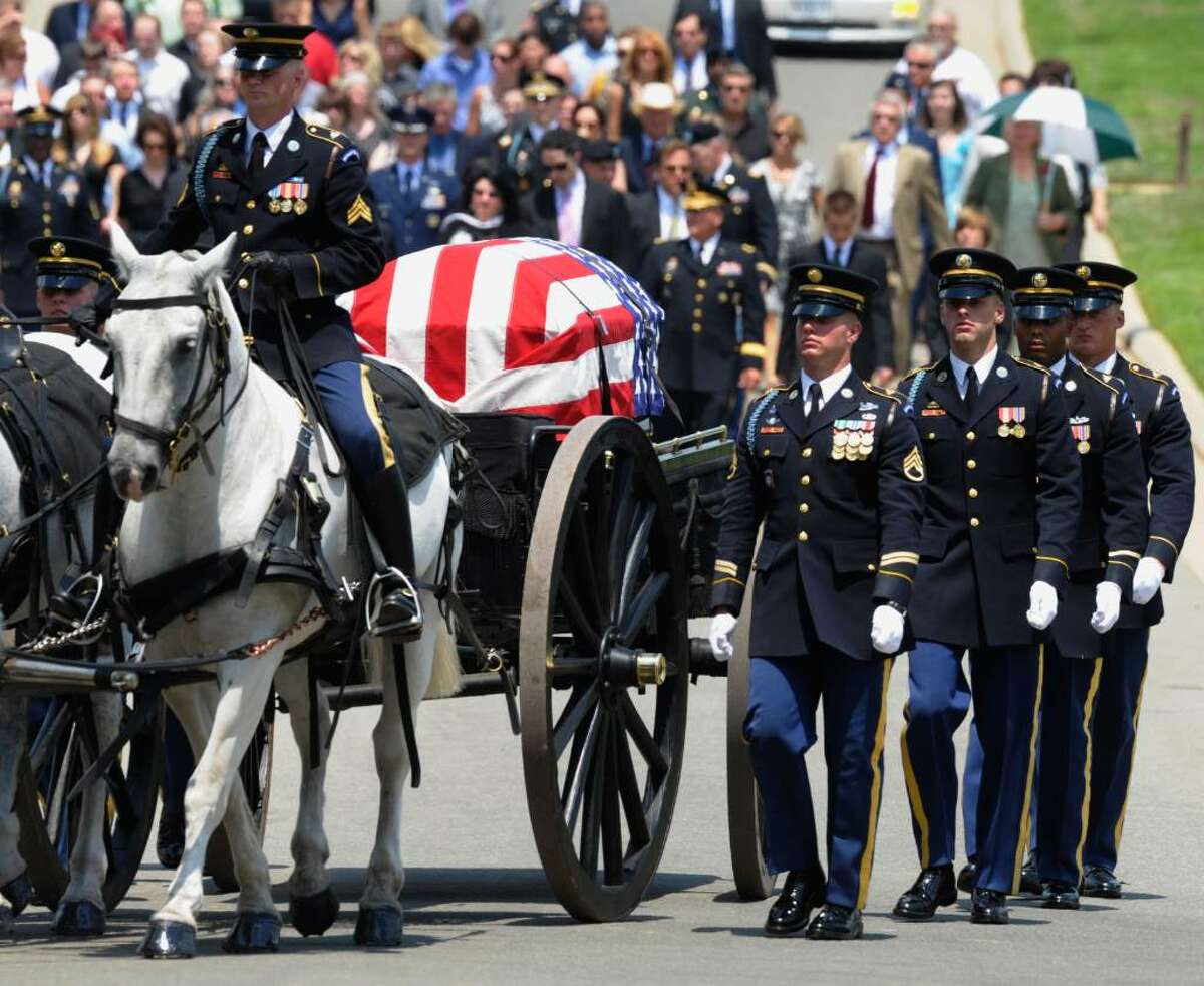A caisson with the casket of Army Pfc. David Taylor Miller is carried to the burial site during his funeral services at Arlington Cemetery in Arlington, Va., Wednesday, July 28, 2010. Miller of Wilton died June 21 in Afghanistan. (AP Photo/Susan Walsh)