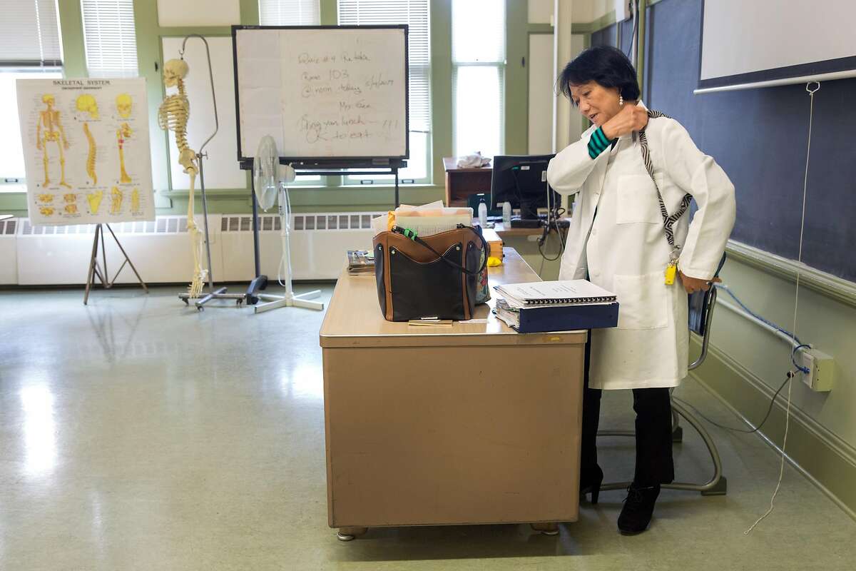 Nursing instructor, Procerpina Gee, RN, PHN, MSN packs her belongings and class instruction materials at the end of her work day at City College of San Francisco - John Adams Center where she works. Tuesday, May 14, 2019. San Francisco, Calif.