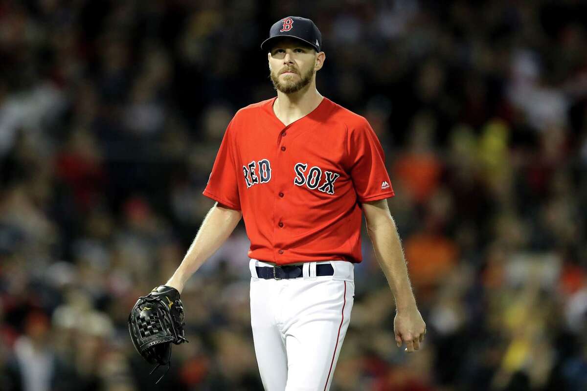 BOSTON, MA - OCTOBER 13: Chris Sale #41 of the Boston Red Sox reacts during the first inning against the Houston Astros in Game One of the American League Championship Series at Fenway Park on October 13, 2018 in Boston, Massachusetts. (Photo by Elsa/Getty Images)