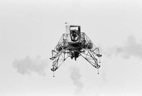 Inflight view of Astronaut Neil Armstrong flying the Lunar Landing Training Vehicle (LLTV) at EAFB. EAFB, Houston, TX