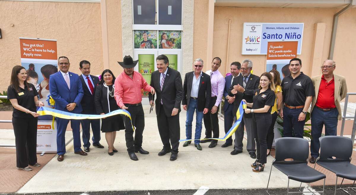 City officials and directors that contributed to the project, perform a ribbon cutting as they inaugurate the Women, Infants and Children Santo Niño Community Center, Tuesday, May 14, 2019, in South Laredo.