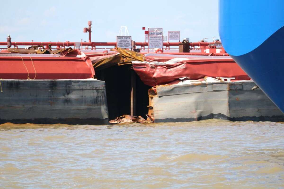 Containment boom removed around the site of the impacted barge 30015T after the remaining product was transferred to another barge on May 14, 2019, near Bayport in the Houston Ship Channel.