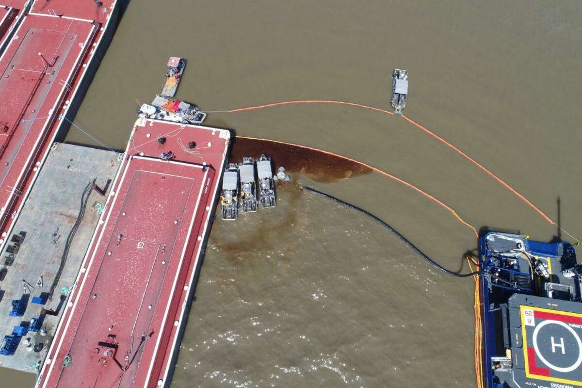 Aerial view of skimmer boats and skimming equipment removing the last of the product around the collision site on the Houston Ship Channel on May 14, 2019 near Bayport. More than 11,000 barrels of a gasoline blend were spilled. There have been three major plant fires — one fatal — in recent months, as well a the vessel collision.