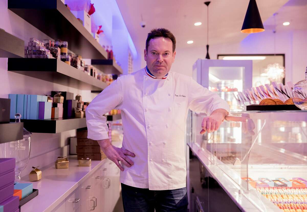 Head Chef Claude Le Tohic poses for a portrait behind the macaron counter at One65 in San Francisco, Calif. Tuesday, May 14, 2019.