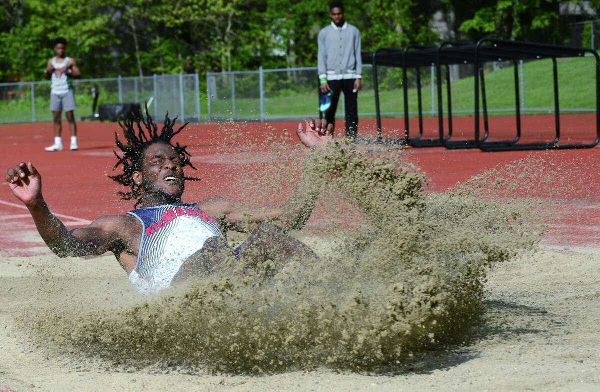 Senator Justin Forde competes in the long jump as the Brien McMahon High School Senators take on the Norwalk High Schools Bears in the intra-city track meet Wednesday, May 15, 2019, at Norwalk High School in Norwalk, Conn.