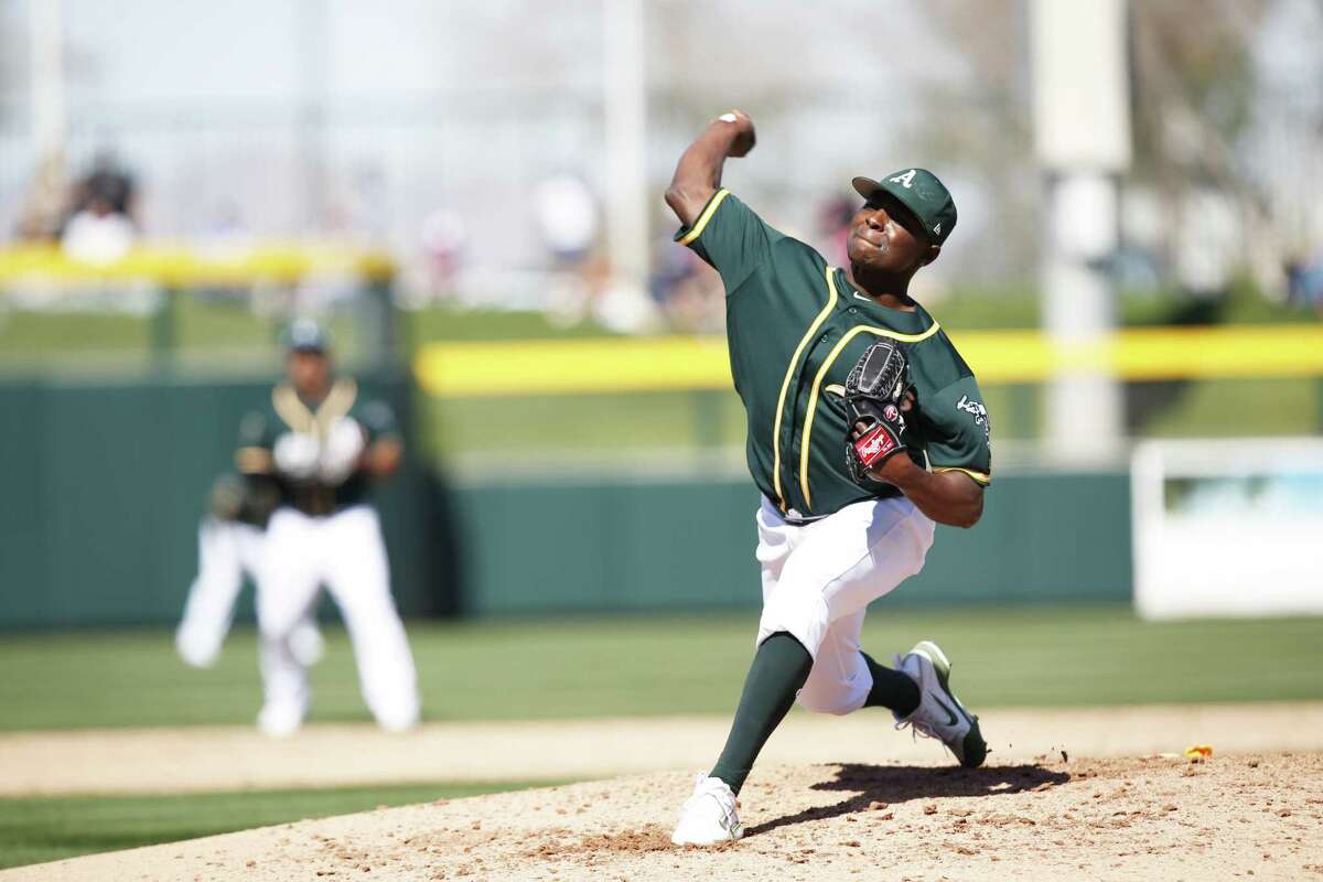 MESA, AZ - FEBRUARY 24: Jharel Cotton #45 of the Oakland Athletics pitches during the game against the San Diego Padres at Hohokam Stadium on February 24, 2018 in Mesa, Arizona. (Photo by Michael Zagaris/Oakland Athletics/Getty Images) *** Local Caption *** Jharel Cotton