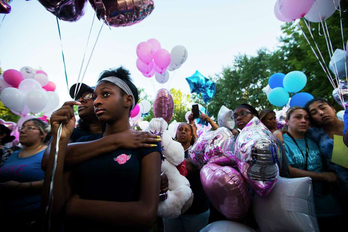Shauntel Huerell embraces her daughter Jazmyn Harrell, 11, at a balloon release ceremony in remembrance of Maleah Davis on Wednesday, May 15, 2019, in Sugar Land.