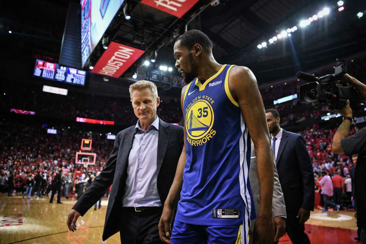 Golden State Warriors head coach Steve Kerr and forward Kevin Durant (35) walk off the court following a loss in game 4 of the NBA Western Conference Semifinals between the Golden State Warriors and Houston Rockets at the Toyota Center in Houston, Texas, on Monday, May 6, 2019.