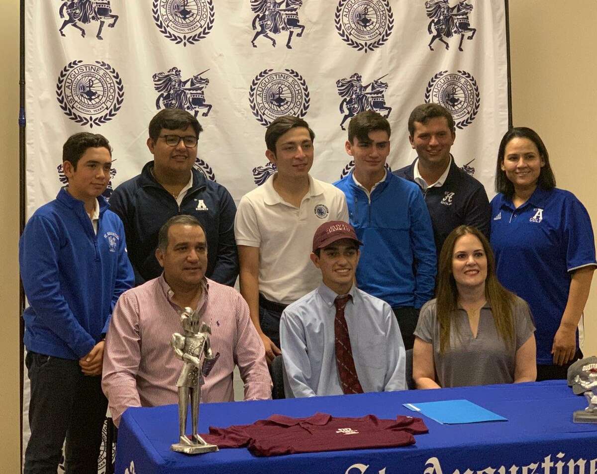 St. Augustine’s Horacio Perez, front center, signed to play for the Texas A&M International men’s golf team Wednesday. Perez was surrounded by his parents and teammates.