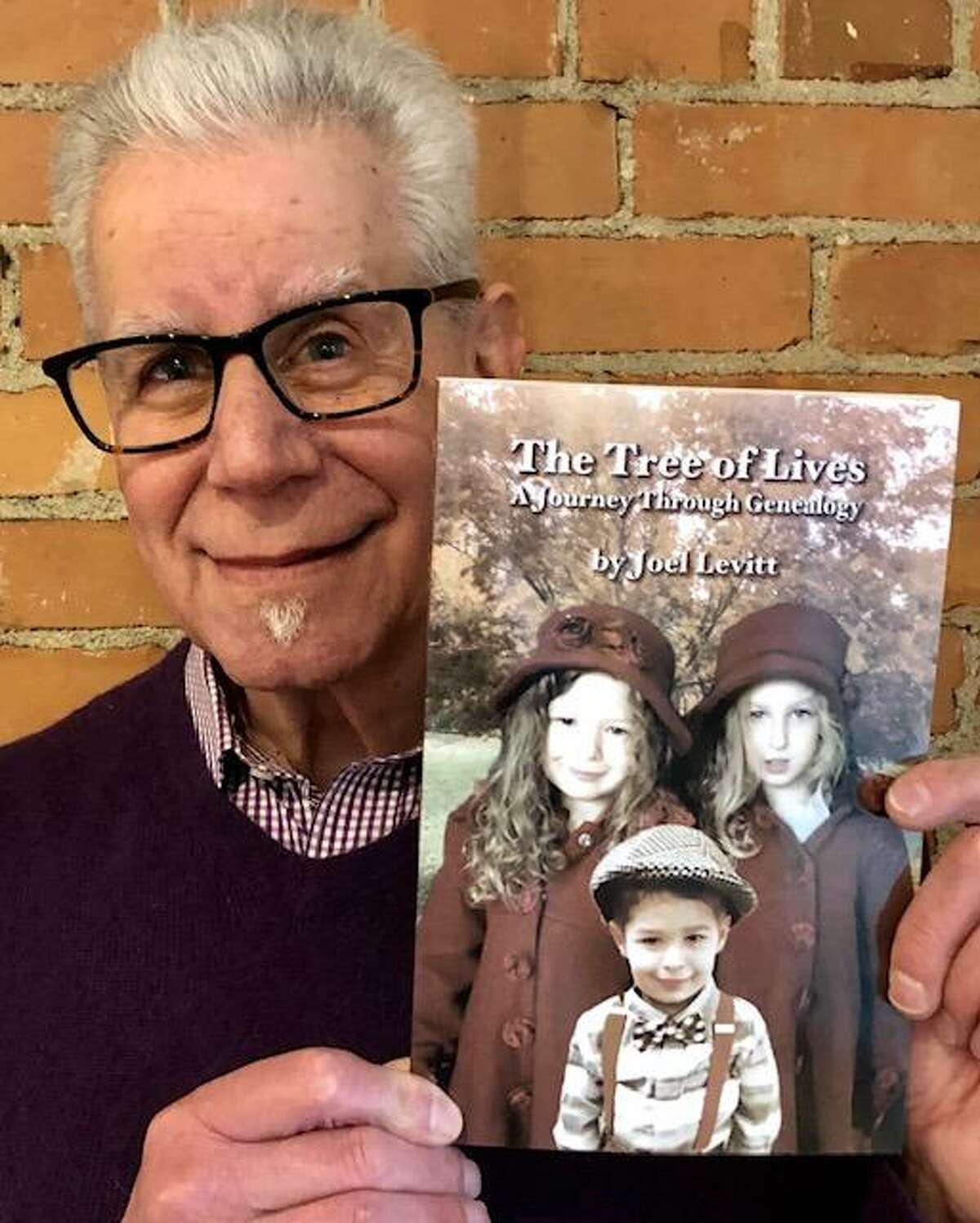 Joel Levitt poses with his new book, “The Tree of Lives.”
