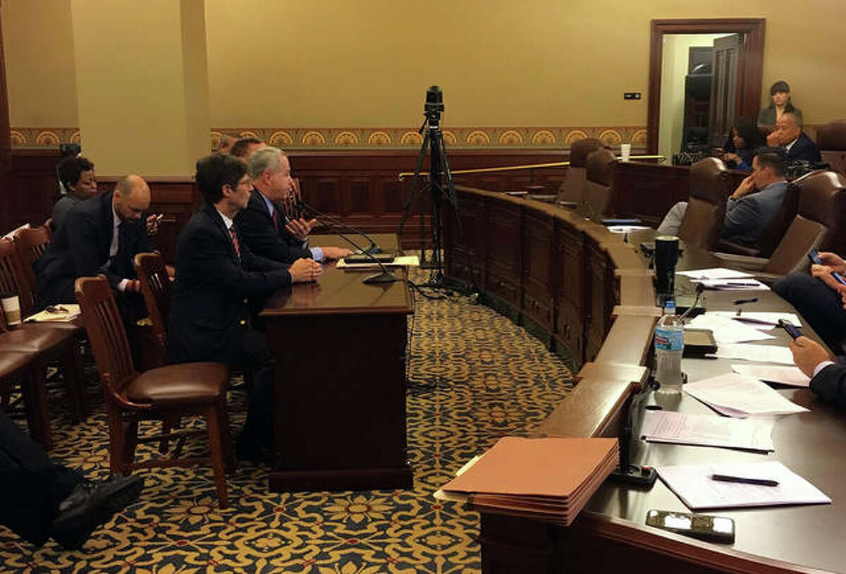 Left to right: Madison County Board member Mike Walters, Illinois State Rep. Jay Hoffman and Madison County Board Chairman Kurt Prenzler testify Wednesday before the House Executive Committee on Senate Bills 584 and 1418, calling for restructuring of appointments on Metro East Sanitary District and Bi-State Development Agency board.
