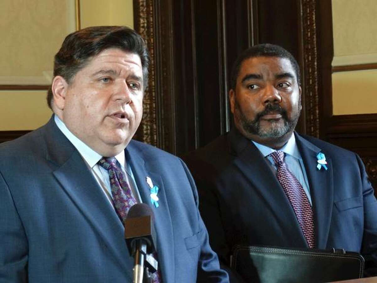With Acting Director Marc Smith looking on, Gov. J.B. Pritzker talks about addressing the recommendations in a study for reforming the state’s Department of Children and Family Services. During a news conference Wednesday, at the Capitol in Springfield, Pritzker said he will carry out all recommendations, which include working with courts and prosecutors to refine the criteria used for removing children from their homes, refining protocols for closing Intact Family Services cases, and improving the quality of supervision within the agency to provide more clear lines of authority and supervision.