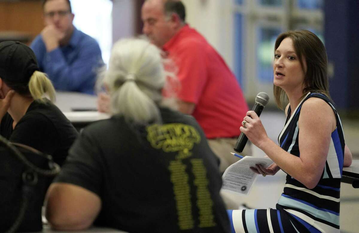 Samantha Reiter, interim general manager of the Lone Star Groundwater Conservation District, right, speaks at the recent community meeting.
