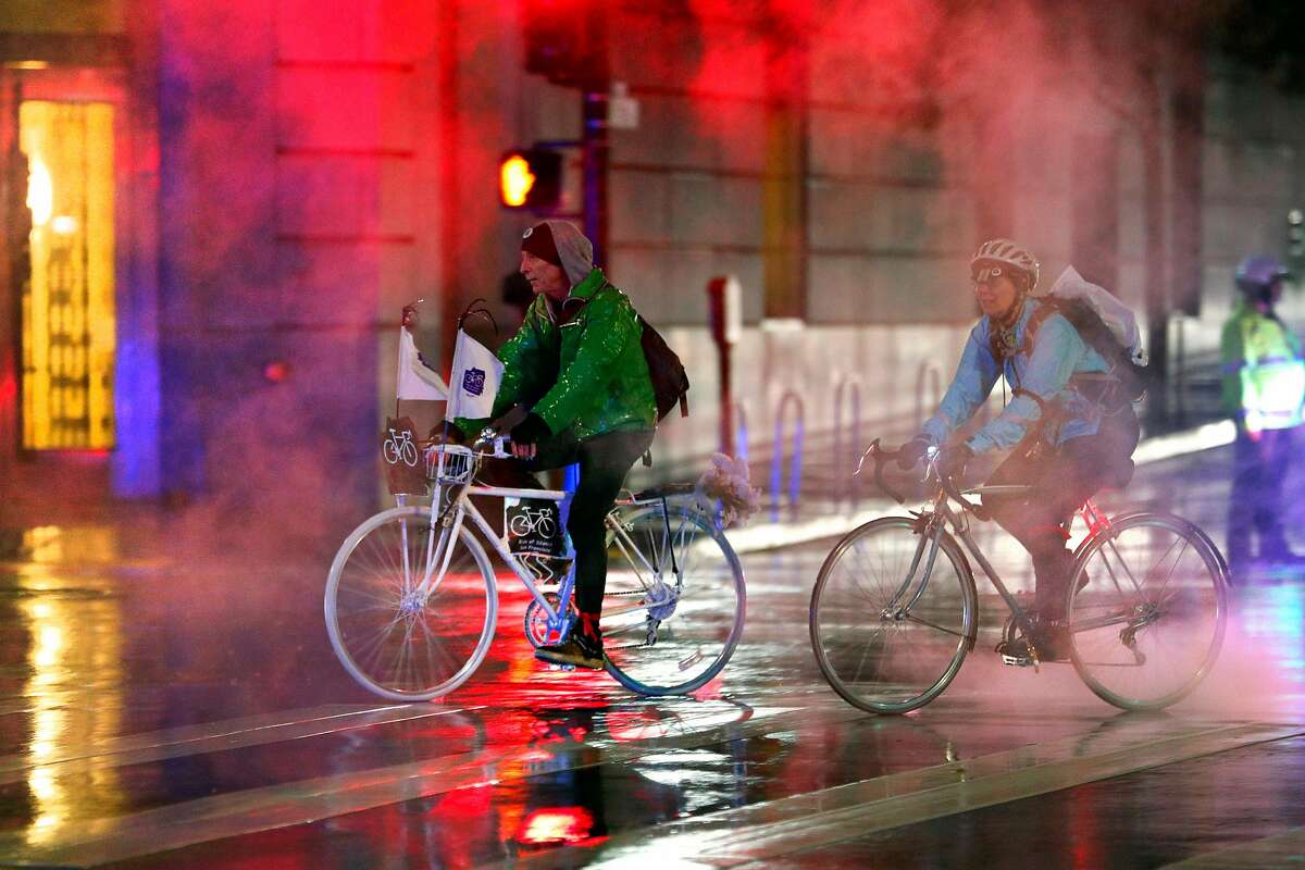 Riders approach City Hall where they would install a Ghost Bike during the Ride of Silence honoring killed cyclists in San Francisco, Calif., on Wednesday, May 15, 2019. Every year, San Francisco cyclists convene for a Ride of Silence to visit the memorials of people killed while riding through the city's crowded, chaotic streets. Traffic deaths spiked this year after a two-year dip, even as the city rushes to paint crosswalks, widen curbs, put up barriers along bike lanes and make other Vision Zero improvements.