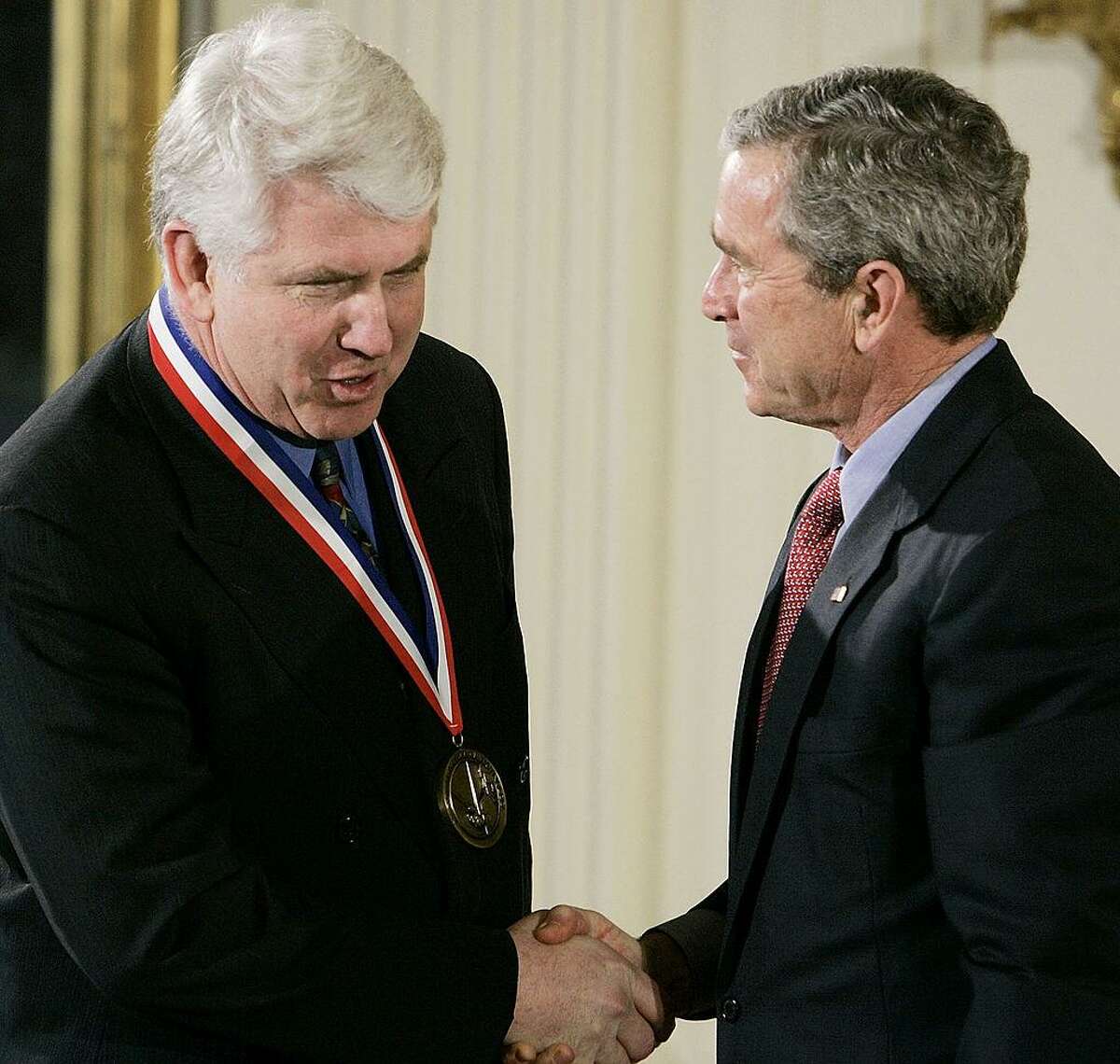 WASHINGTON - MARCH 14: U.S. President George W. Bush (R) shakes hands with Robert Metcalfe during a presentation of the National Medals of Science and Technology in the East Room of the White House, March 14, 2005 in Washington DC. Metcalfe won the medal, the nations highest honor for technological achievement, for inventing and standardizing Ethernet, the system for networking computers within a building using hardware. (Photo by Mark Wilson/Getty Images)