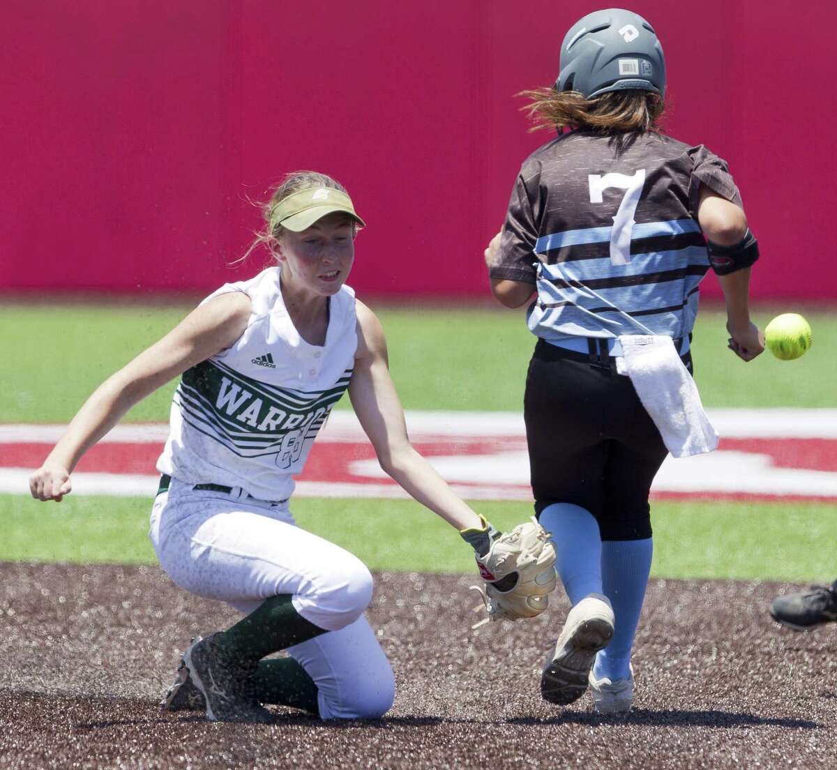 The Woodlands Christian Academy shortstop Ashley Darilek (88) tries to field a throw to second as Madorry Gonzales #7 of Waco Reicher Catholic High School reaches base safely in the second inning during the TAPPS Division III state championship game at The Ballparks in Crosby, Thursday, May 16, 2019, in Crosby.