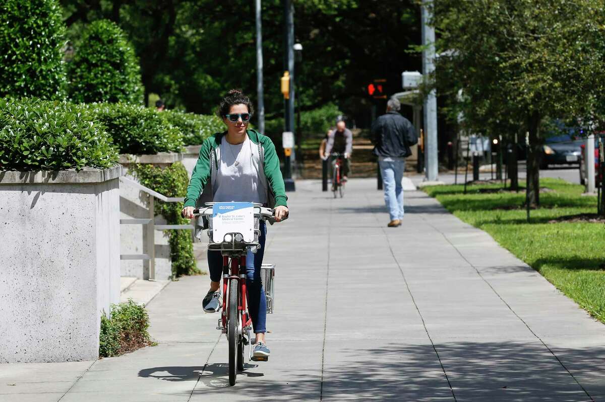 "I use it all the time to go and get coffee or to run quick errands" Gisele Caleron said as she checked out a B-Cycle bike sharing system bike in the Med Center on April 2, 2019, in Houston. The city unveiled its climate action plan Thursday, July 26, 2019, in which it sets a pathway to become carbon neutral by 2050. One way to reduce emissions is by promoting alternate modes of transportaiton, including biking.