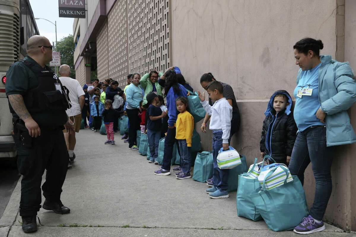 Migrants are dropped off across the street from the Greyhound Station in downtown San Antonio, Wednesday, May 15, 2019. Volunteers take the mostly Central American migrants from the station to the City of San Antonio Resource Center where they are provided with humanitarian needs. The center opened on March 30 and with help of nonprofits, has served around 8,000 according to City Manager Erik Walsh.