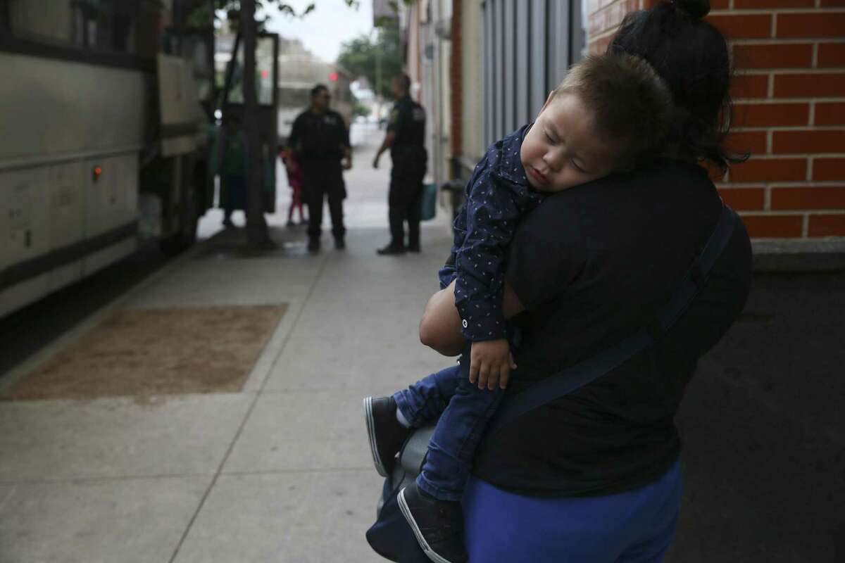 A migrant mother waits to be escorted to the Greyhound Station after there are dropped off in downtown San Antonio, Wednesday, May 15, 2019. Volunteers take the mostly Central American migrants from the station to the City of San Antonio Resource Center where they are provided with humanitarian needs. The center opened on March 30 and with help of nonprofits, has served around 8,000 according to City Manager Erik Walsh.