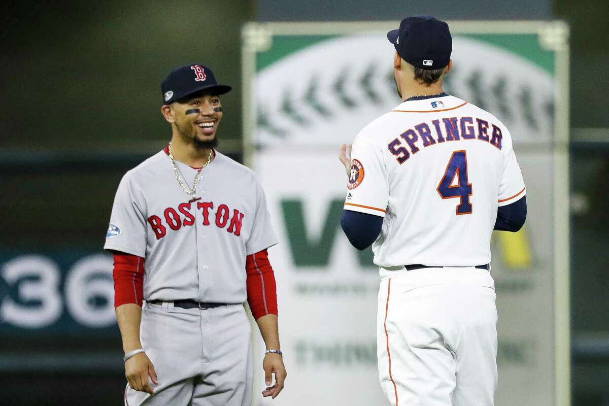 Red Sox outfielder Mookie Betts, who won last year’s AL MVP award, chats it up with the Astros’ George Springer, a contender for this year’s honor, during last year’s American League Championship Series.