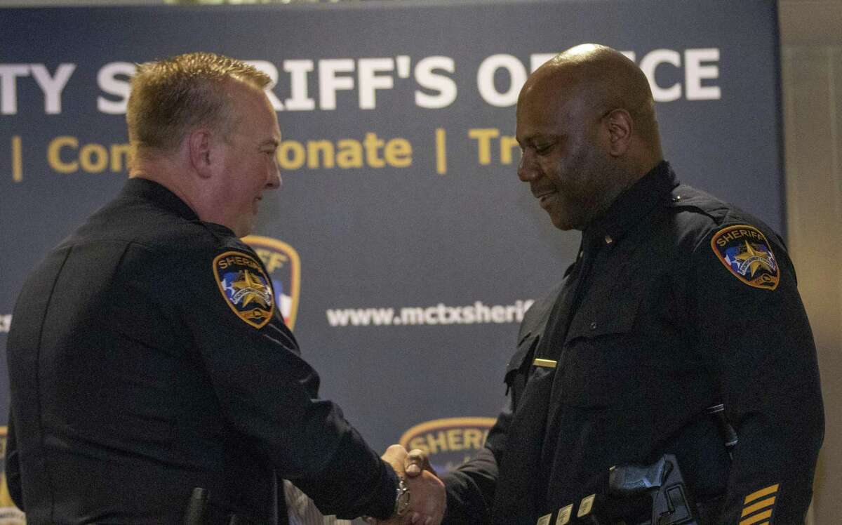 Lt. Jermaine Jenkins shakes hands with sheriff Rand Henderson before having his new badge pinned to his uniform during a Montgomery County Sheriff’s Office promotion ceremony Thursday, May 16, 2019 at The Lone Star Convention & Expo Center in Conroe.