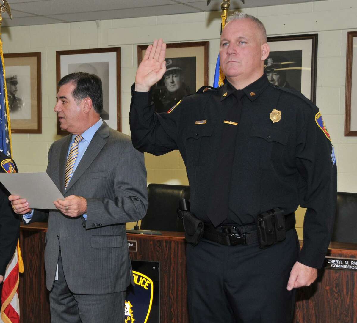 Christopher Broems is sworn in as a sergeant by then Mayor Michael Pavia at the Stamford Police Department in 2012.