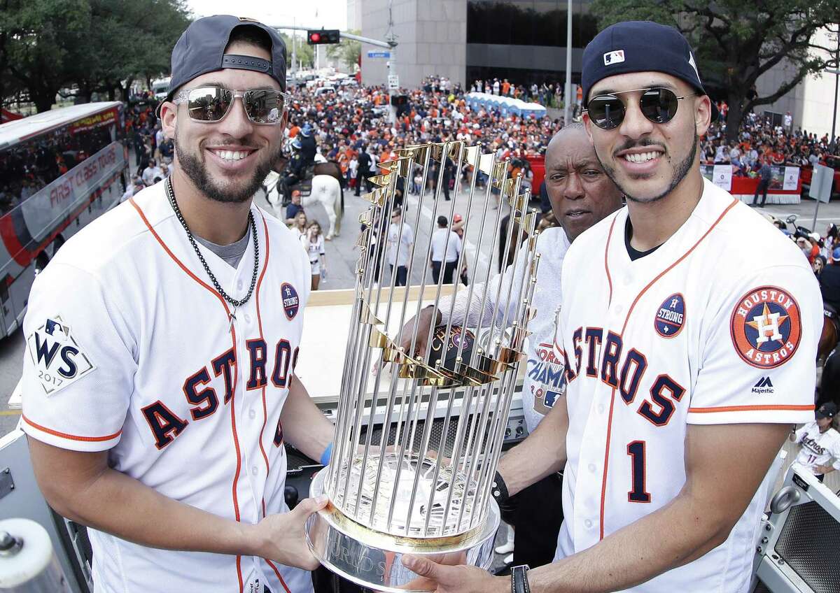 George Springer, left, and Carlos Correa are two parts of a remarkable nucleus that has the Astros aiming for more than just their 2017 championship.