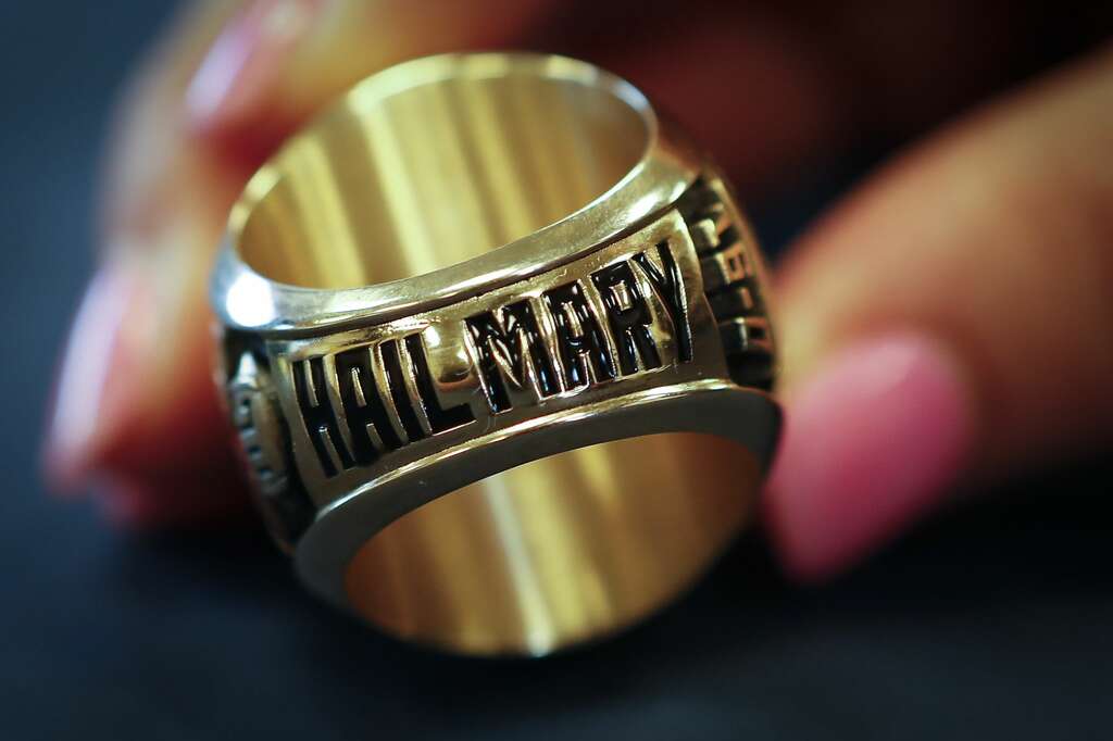 <p>Hail Mary is inscribed on the bottom of North Shore head coach Jon Kay's state championship ring before a ring ceremony for the players Thursday, May 16, 2019, in Houston. Last fall North Shore captured its</p>