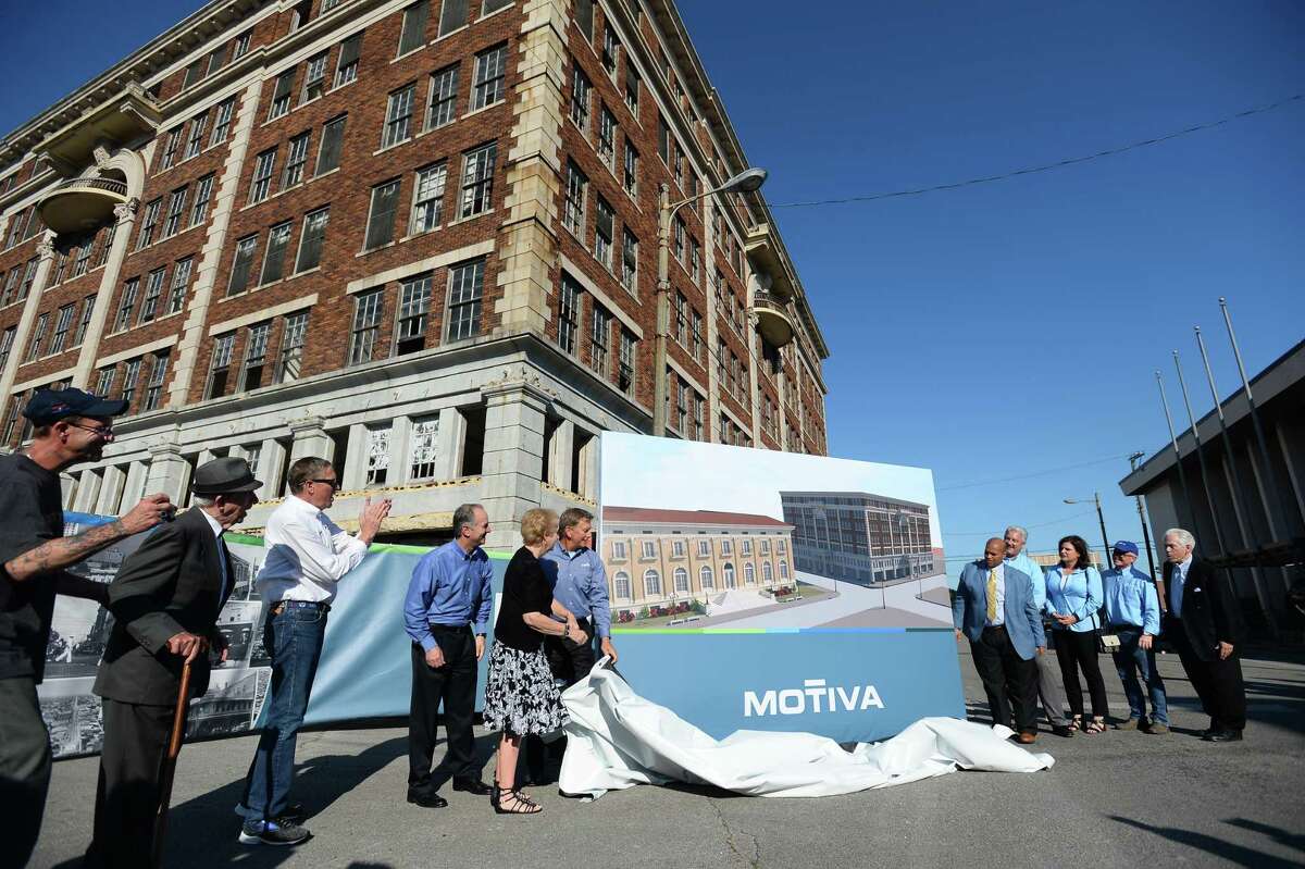 People from Motiva and Port Arthur unveil building plans in front of the Adams building during Motiva and The Greater Port Arthur Chamber of Commerce's "Imagine Port Arthur" in downtown Port Arthur Thursday. Photo taken on Thursday, 05/16/19. Ryan Welch/The Enterprise