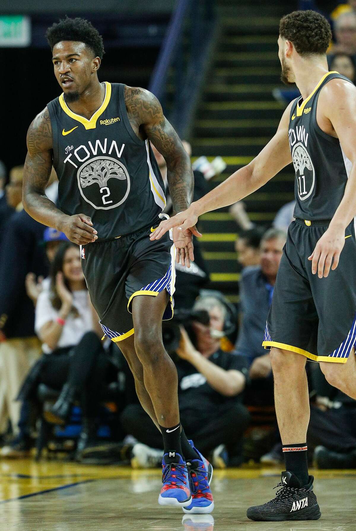 Golden State Warriors’ Jordan Bell gets a high five from Golden State Warriors’ Klay Thompson in the second quarter during game 2 of the Western Conference Finals between the Golden State Warriors and the Portland Trail Blazers at Oracle Arena on Thursday, May 16, 2019 in Oakland, Calif.