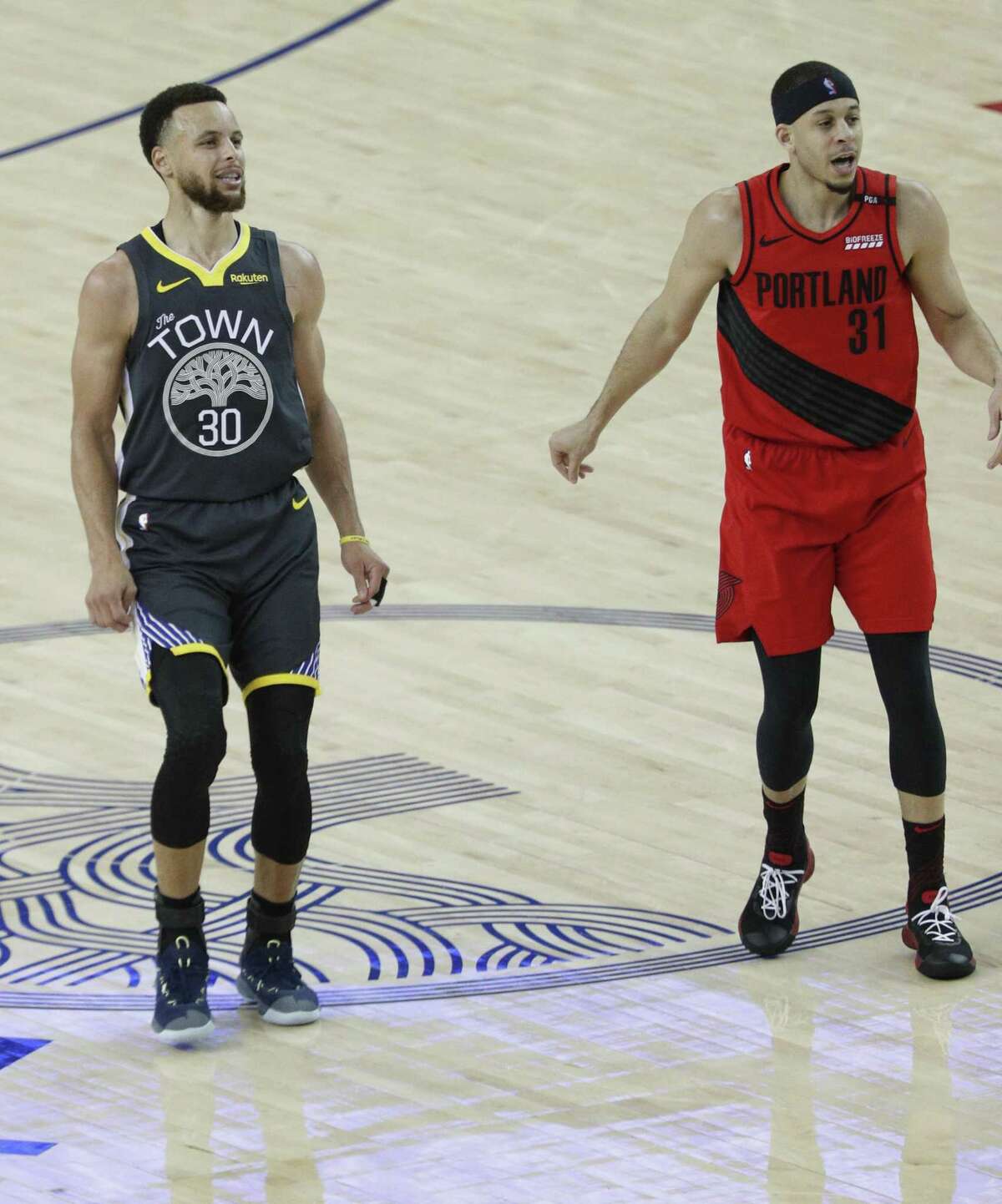 Golden State Warriors’ Stephen Curry and Portland Trail Blazers’ Seth Curry watch the results of Curry’s shot in the third quarter during game 2 of the Western Conference Finals between the Golden State Warriors and the Portland Trail Blazers at Oracle Arena on Thursday, May 16, 2019 in Oakland, Calif.