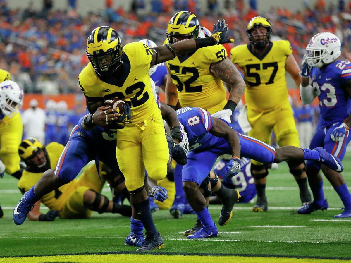 PHOTOS: Players from Houston high schools and Texas college drafted in 2019  Michigan running back Karan Higdon (22) reaches the end zone for at touchdown on a running play after getting through Florida linebacker David Reese, left, and defensive back Nick Washington (8) in the second half of an NCAA college football game, Saturday, Sept. 2, 2017, in Arlington, Texas. (AP Photo/Roger Steinman)  >>>A look at players who were taken in the 2019 NFL Draft that went to Houston high schools or Texas colleges ... 