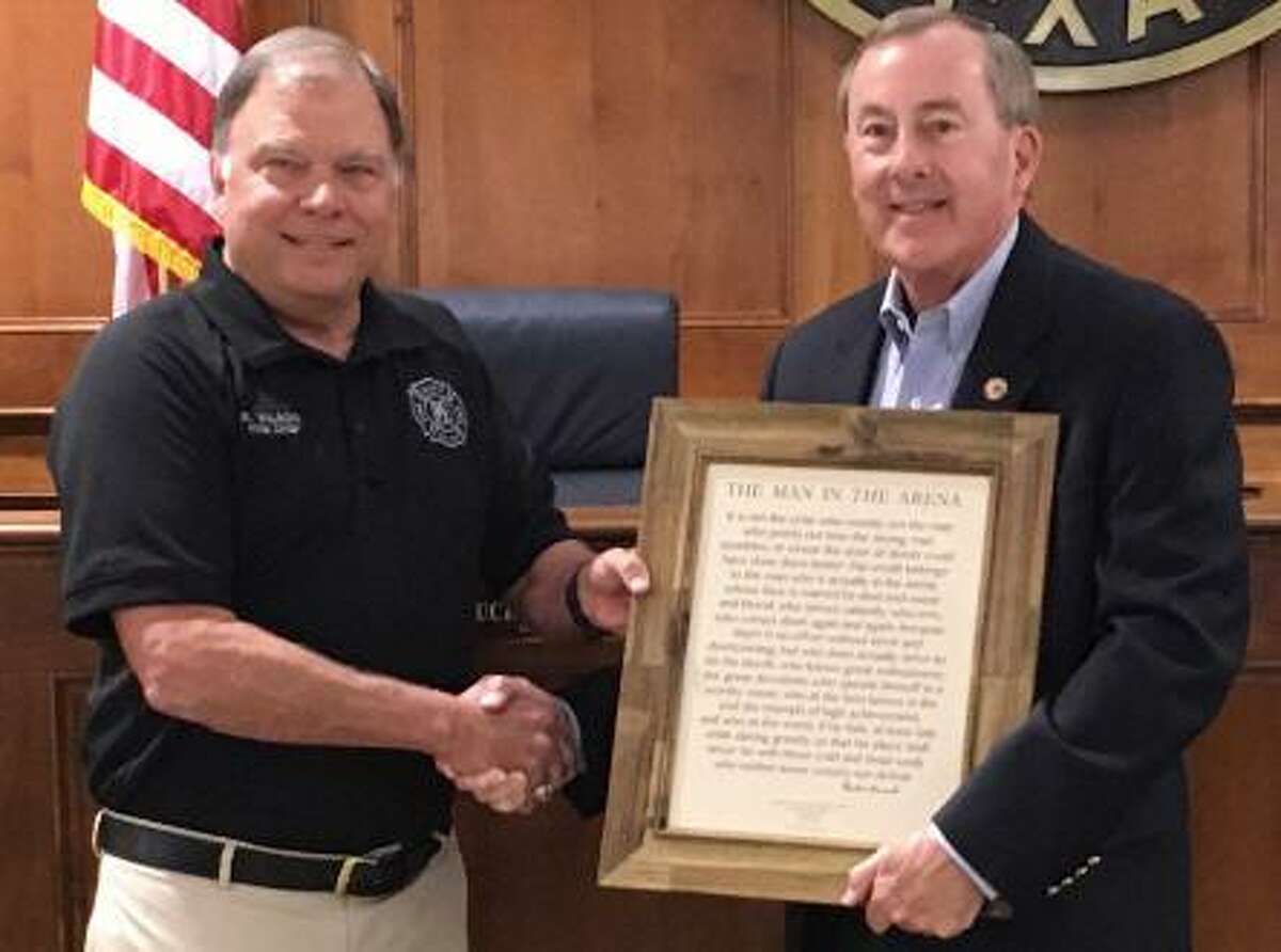Katy Fire Chief Rusty Wilson presented a framed copy to outgoing Katy Mayor Chuck Brawner of former president Theodore Roosevelt’s “The Man in the Arena” speech. In part, the speech reads: “It is not the critic who counts; not the man who points out how the strong man stumbles, or where the doer of deeds could have done them better. The credit belongs to the man who is actually in the arena, whose face is marred by dust and sweat and blood; who strives valiantly; who errs, who comes short again and again, because there is no effort without error and shortcoming.” Wilson praised and thanked Brawner for his support of public safety.