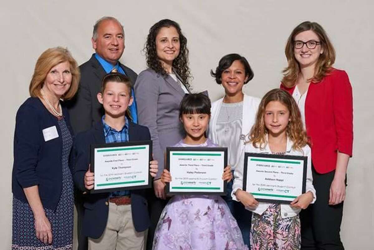 Middlefield student Addison Nappi, bottom row, far right, stands other third-grade eesmarts student contest award finalists and officials, left to right: Avon Town Councilwoman Heather McGuire, Ron Araujo, Eversource; Mary Sotos, DEEP deputy commissioner; state Rep. Tammy Exum; and Jane Lano, United Illuminating. She took second place in her category at the May 9 ceremony at the state Capitol.