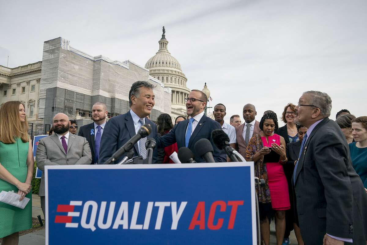 Rep. Mark Takano, D-Calif., left, is greeted by Chad Griffin, president of the Human Rights Campaign, as they and other advocates for LGBTQ rights rally before a vote in the House on the “Equality Act” in 2019. A new vote on the bill is expected this week.
