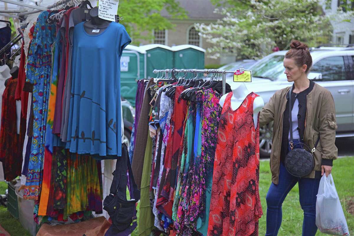Cori Adams of Westport checks out one of the many vendors at the 84th annual Dogwood Festival at Greenfield Hill Congregational Church on Friday, May 10, 2019, in Fairfield, Conn.
