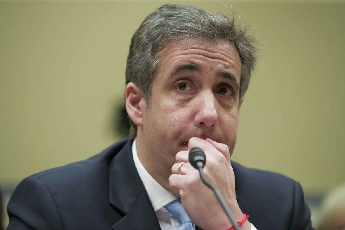 FILE - In this Feb. 27, 2019, photo, President Donald Trump's former personal lawyer Michael Cohen listens to a question while testifying before the House Oversight and Reform Committee, on Capitol Hill, in Washington DC. On May 6 , 2019, Cohen is scheduled to begin a three-year sentence at the Federal Correctional Institution, Otisville in Mount Hope, N.Y., for tax evasion, lying to Congress and campaign finance crimes. (AP Photo/Alex Brandon, File)