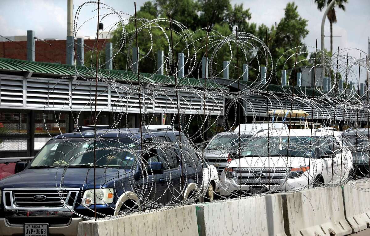 Razor wire attached to traffic barriers have been placed on the international bridge separating Laredo and Nuevo Laredo in anticipation of any migrant problems.
