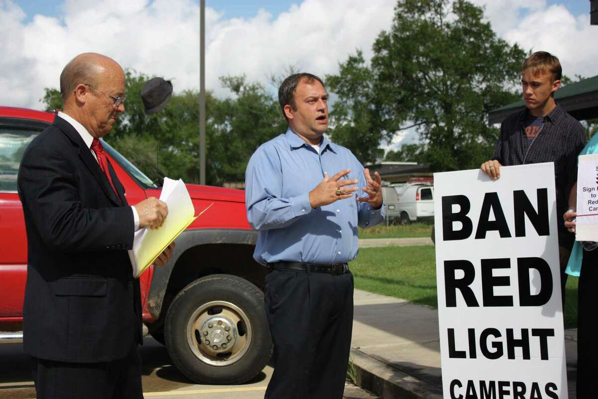 Byrom Schirmbeck, center, a Baytown resident that led efforts to remove the city’s red light cameras, also helped the Tri-County Texas Tea Party in Cleveland oppose the cameras.
