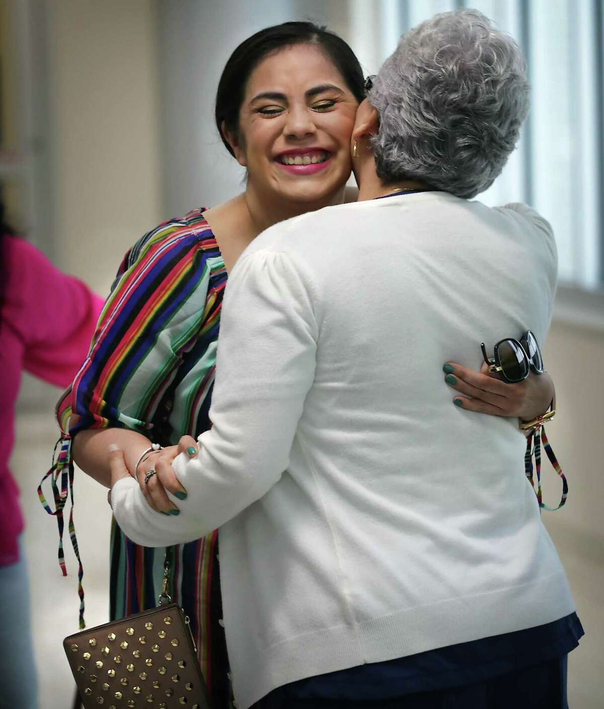 Celma Herrera hugs nurse Vicenta Gutierrez, who sang "Chiquitita" by ABBA every day to Herrera to help regain her memory. Herrera was reunited on May 17, 2019, with the neurological intensive care doctors and nurses at Methodist Hospital in San Antonio who helped save her life and deliver her baby boy seven months ago.