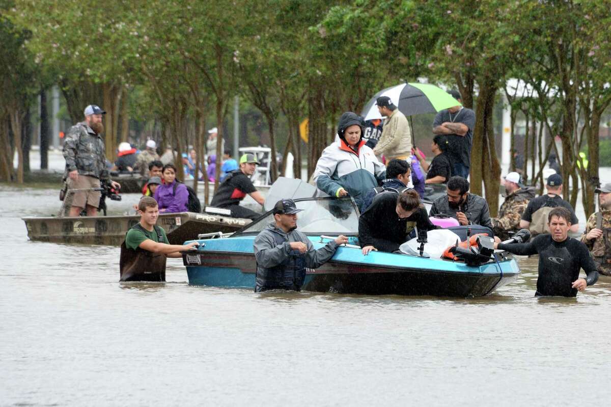 Residents of the Cinco Ranch and Kelliwood areas of Ft. Bend and Harris Counties evacuate from the west side of the Barker Reservoir along Westheimer Parkway in Katy, TX on August 29, 2017.