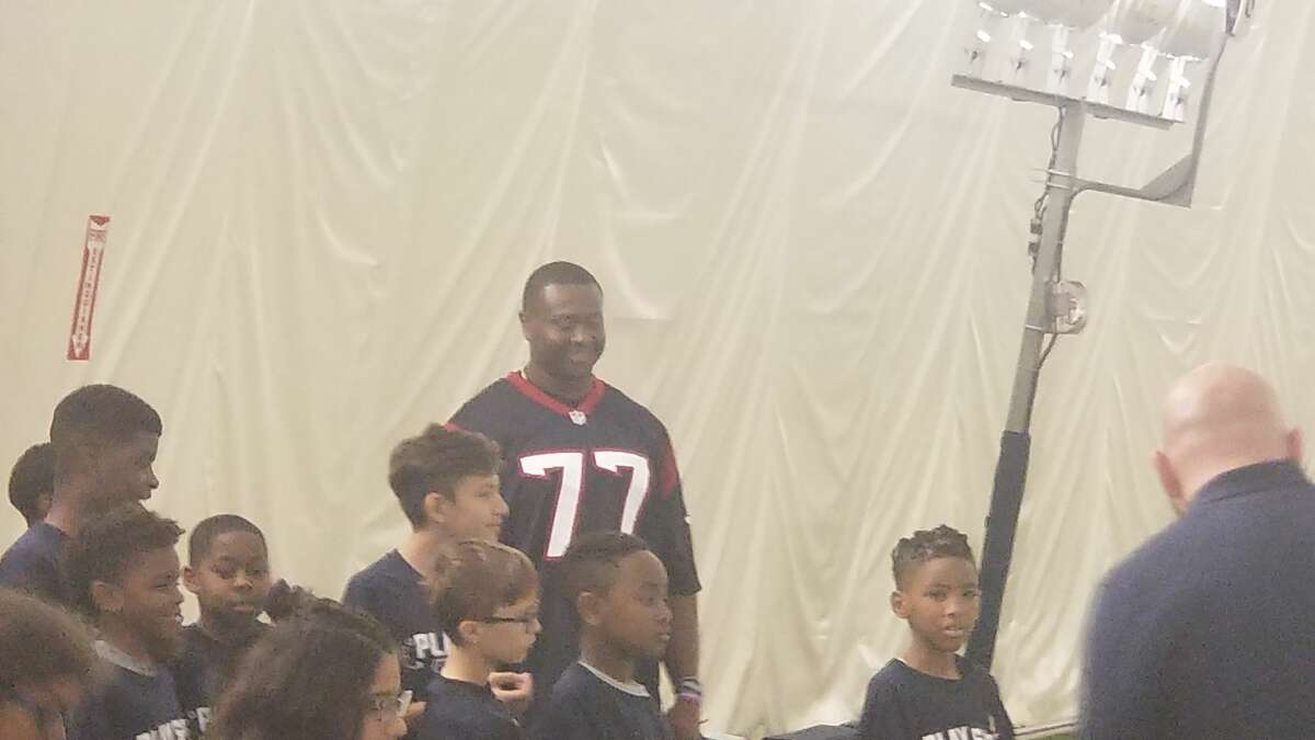 Offensive lineman Martinas Rankin participating in a Play Safe football clinic. 