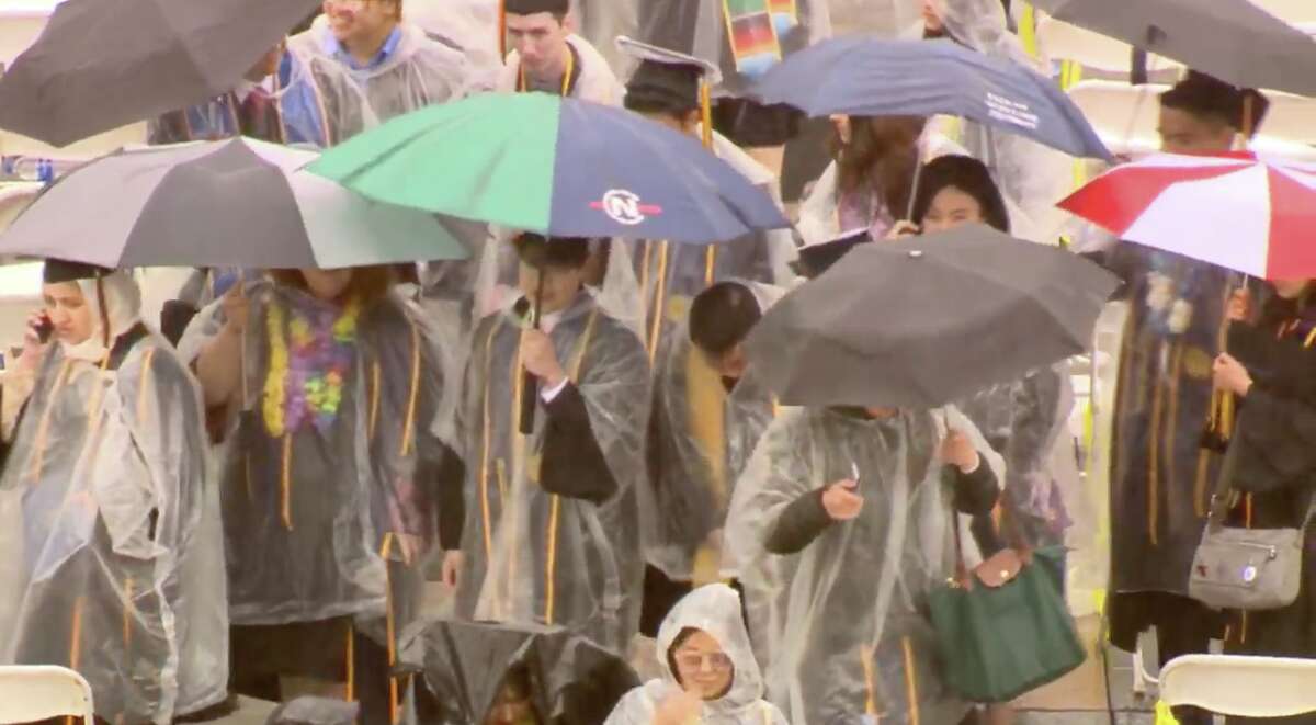 UC Berkeley graduates celebrate in the rain after commencement, as a storm moved through the Bay Area and soaked the crowds at Memorial Stadium in Berkeley.