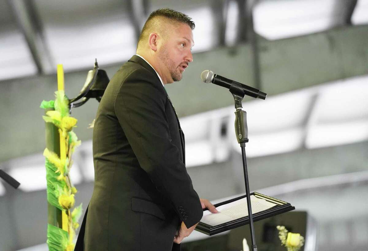 Santa Fe Mayor Jason Tabor addresses the attendees of a candlelight vigil in honor of the one-year anniversary of the Santa Fe High School shooting on Saturday, May 18, 2019 in Hitchcock.