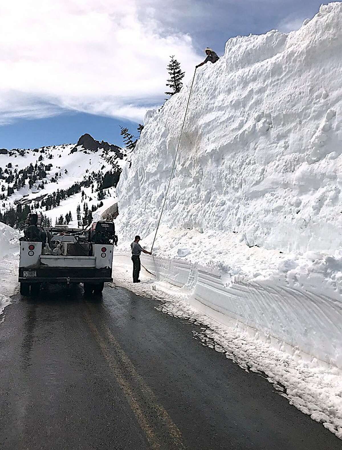 Road crews measured the snow wall at 28 feet high on the Lassen Park Highway at Lassen Volcanic National Park