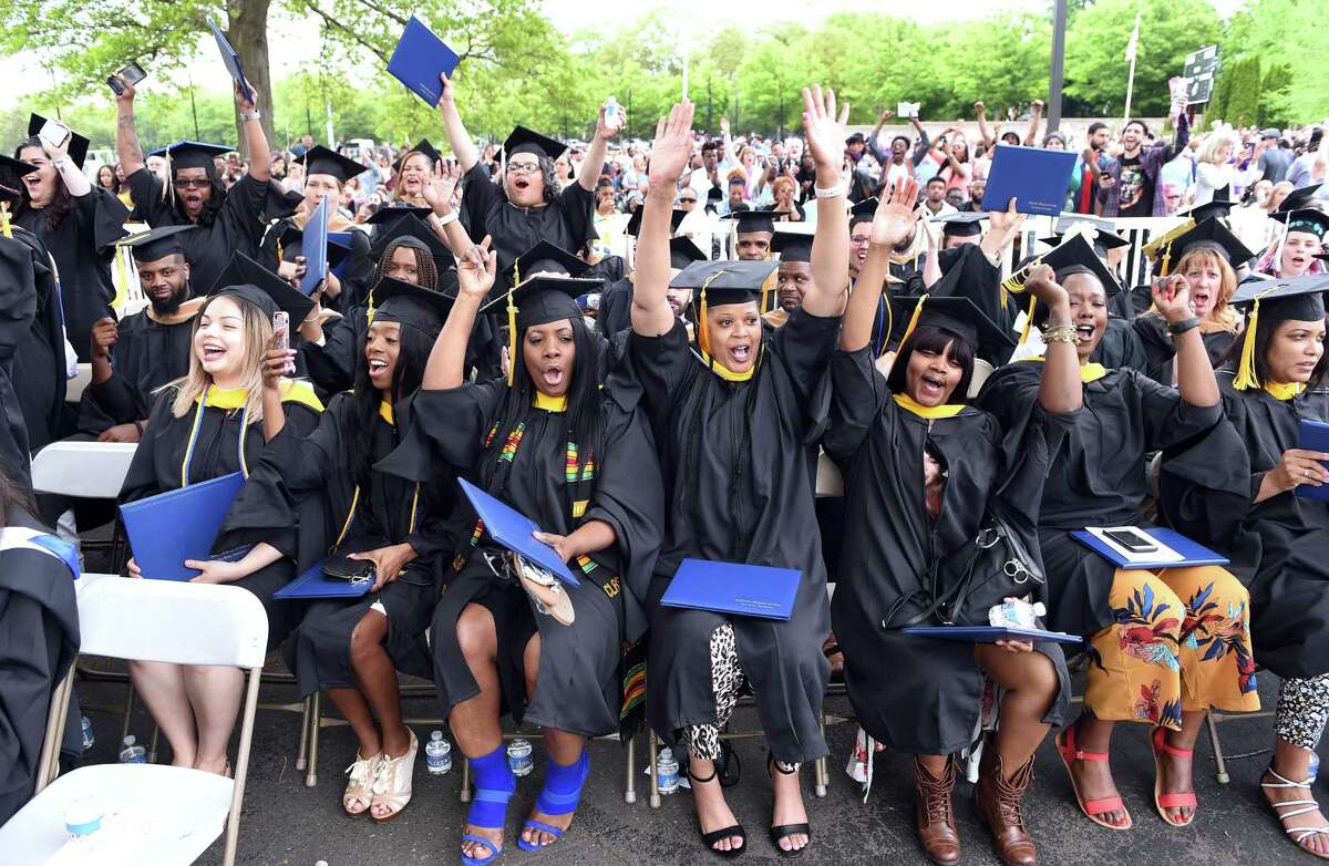 Graduates celebrate near the end of the Albertus Magnus College Commencement in New Haven on May 19, 2019.